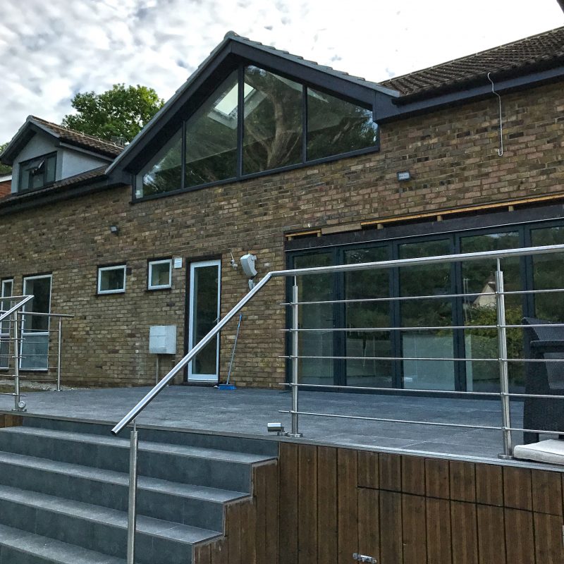 Swimming pool with raised decking surround built by Nationserv