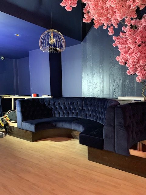 Interior of The Blossom Room showing the bespoke bar and seating area built by Nationserv