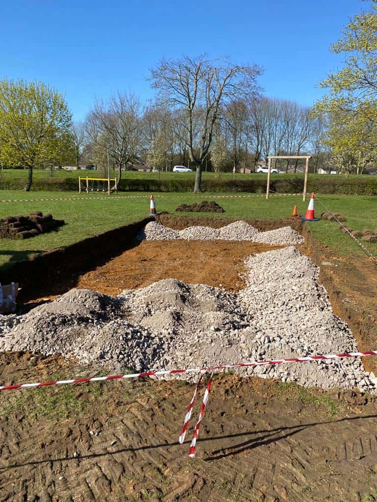 Children playing in giant sandpit at Trotts Hill School