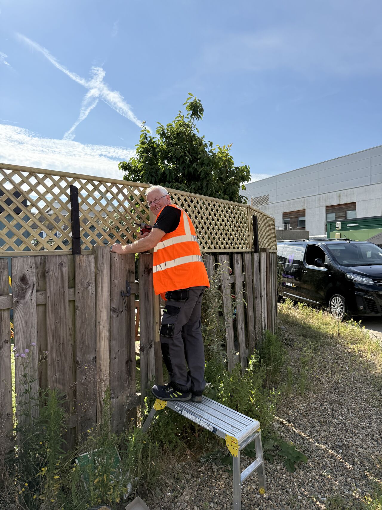 Nationserv staff fitting the new trellis fence at Lister Hospital